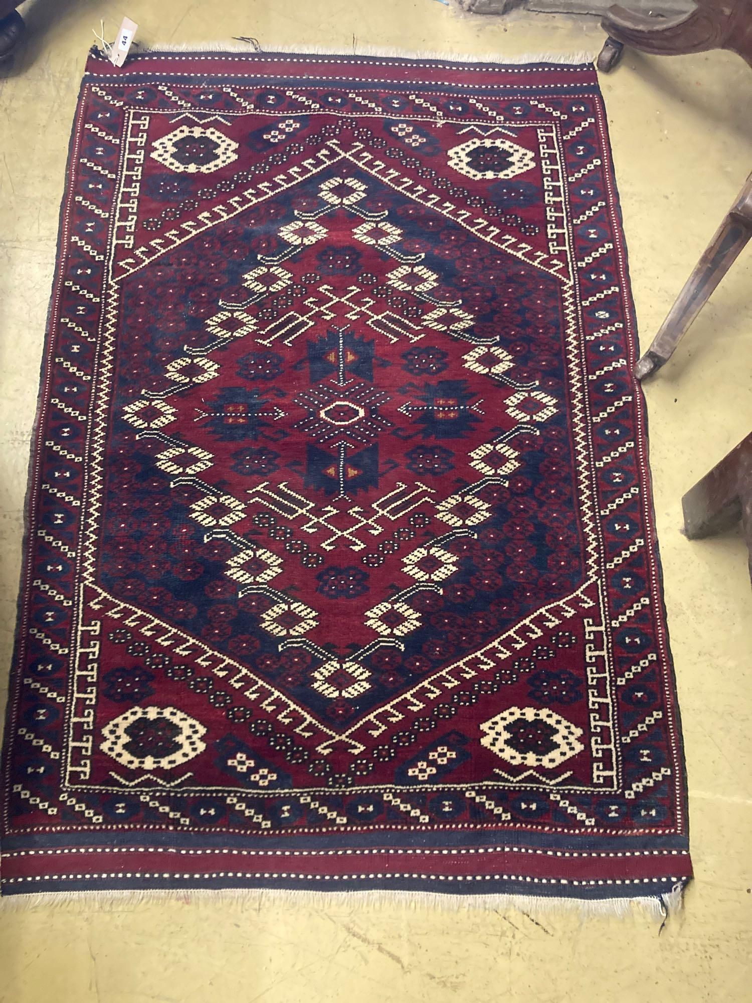 A North West Persian madder ground rug, 125 x 88cm